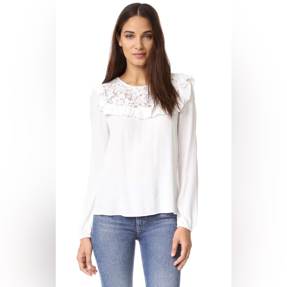 White lace blouse that can easily be casually styled or worn to the office.
